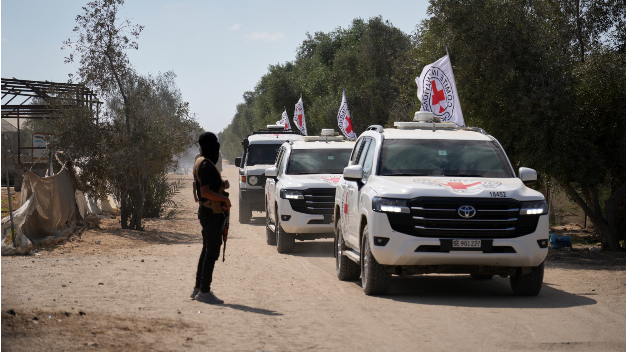 ICRC convoy drives through a damaged Gaza neighborhood during facilitation work