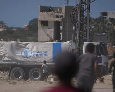 Aid trucks line up at Kerem Shalom as Gaza ceasefire hinges on posted gate hours and fuel deliveries