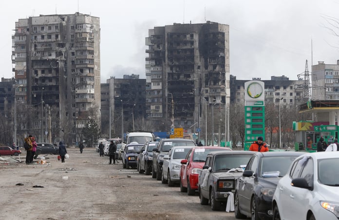 Kyiv traffic moving through dark streets during scheduled power cuts after renewed strikes