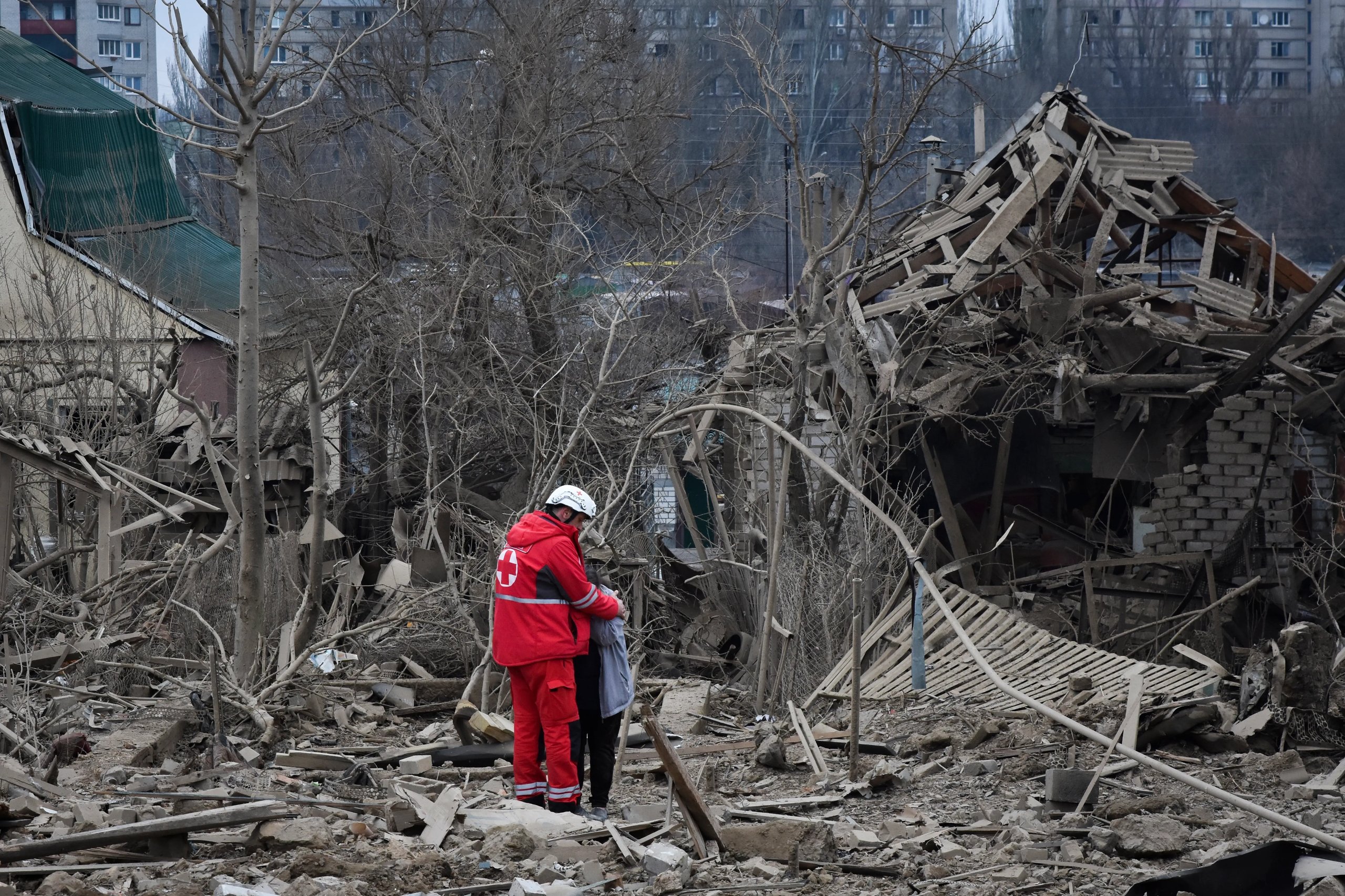 Residents in Novhorod-Siverskyi clear debris after an overnight drone strike that killed four people.