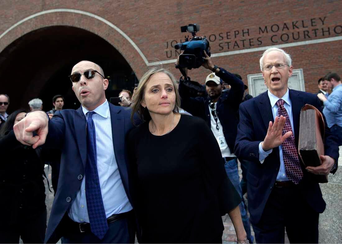 Lawyers and family members outside a courthouse after a detention hearing