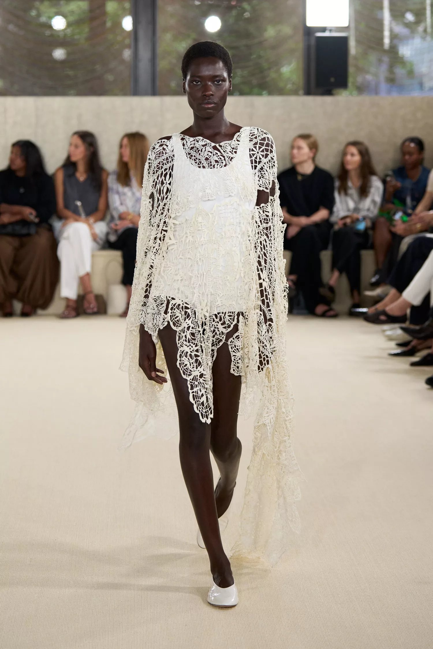 Runway look in Paris showing lined sheer panels and architectural tulle