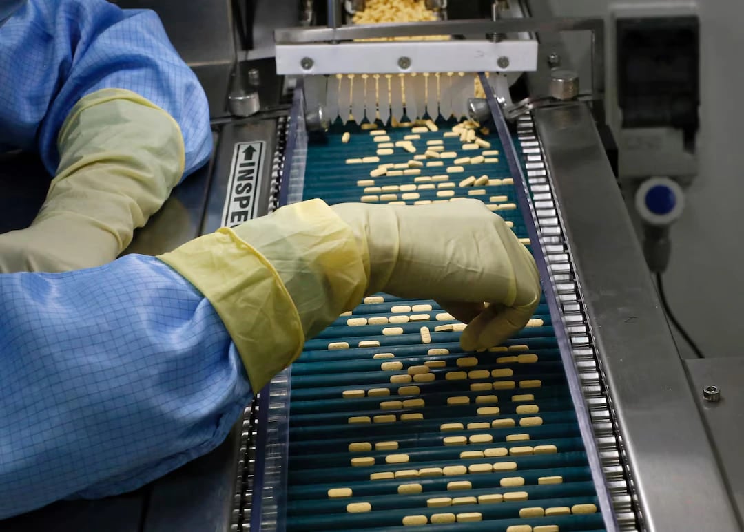 Tariffs and the drug supply chain Pharmaceutical manufacturing line with blister packs amid tariff uncertainty