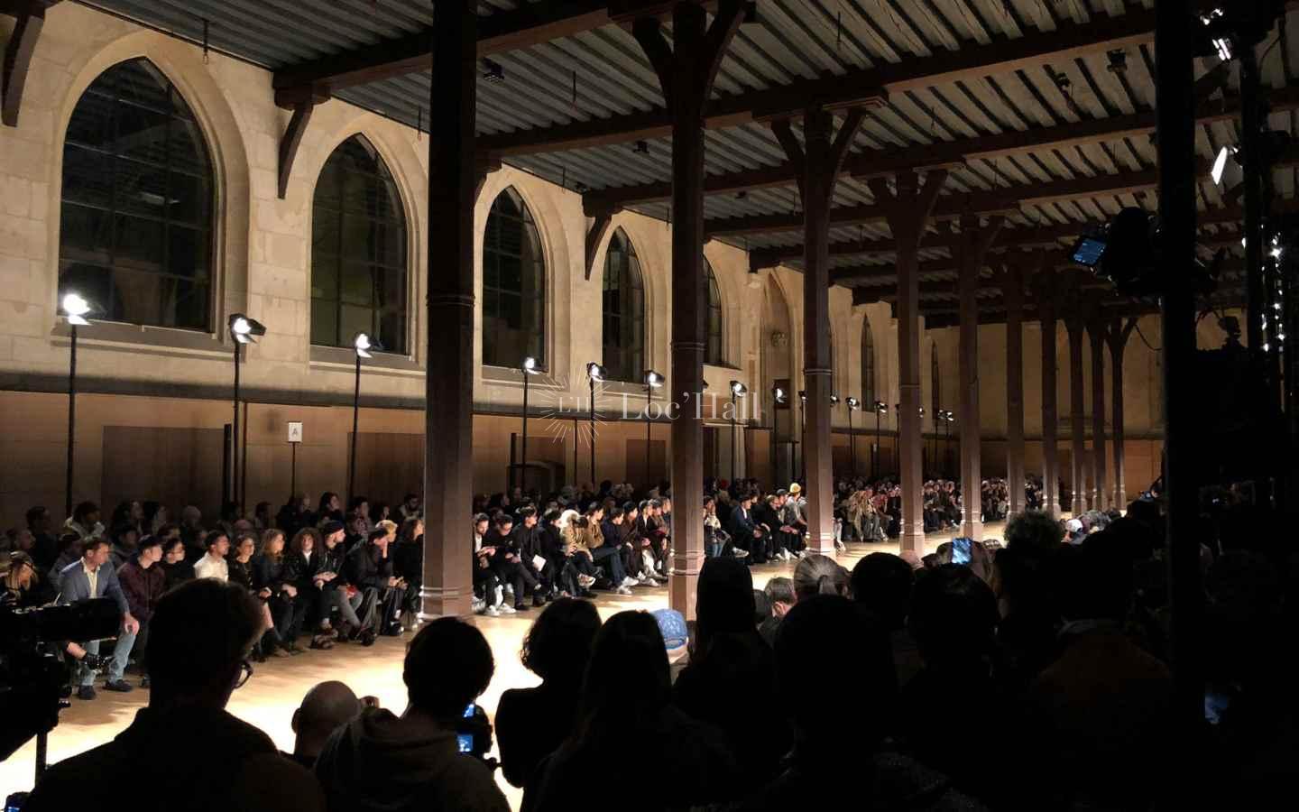 Interior of the Réfectoire des Cordeliers in Paris, long hall with stone arches used for fashion shows.