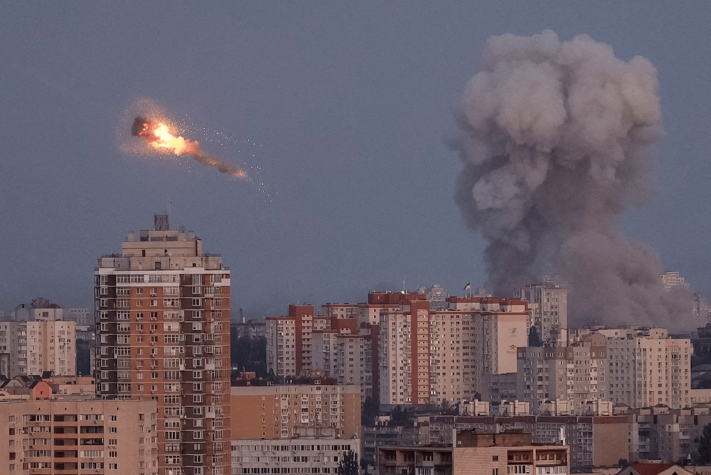 Air defense intercepts over Kyiv during Russia Ukraine war, night sky streaks and explosions