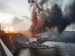 Smoke over Kyiv after an overnight drone and missile barrage that triggered rolling blackouts