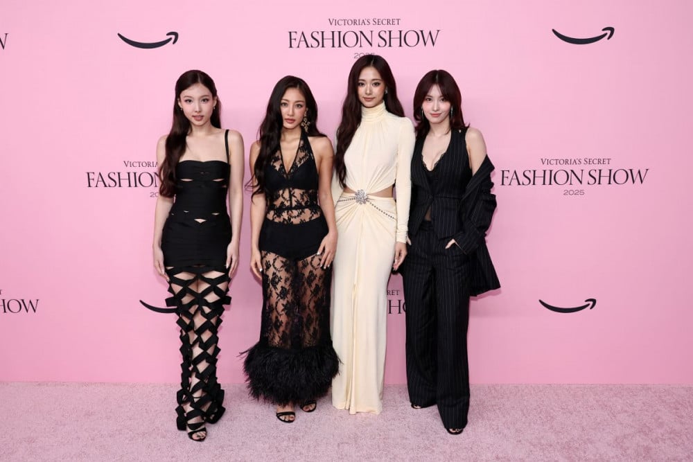 TWICE on stage—Victoria’s Secret 2025 TWICE members on the Victoria’s Secret 2025 stage, dressed in black and cream looks