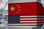 US and China flags over shipping containers at a port