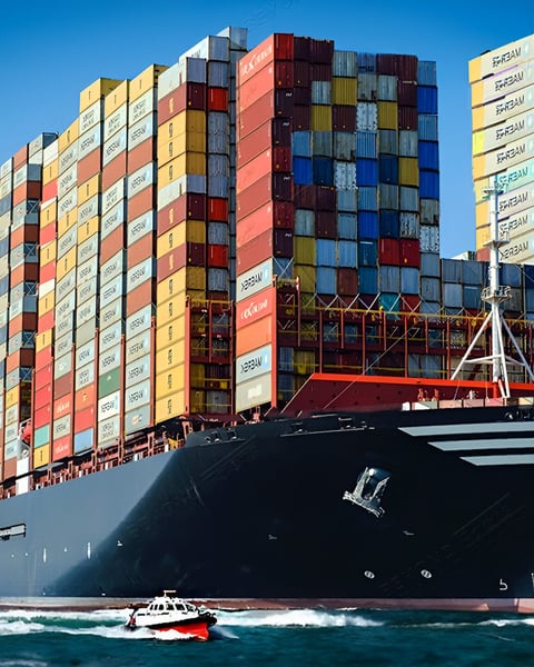 Container ship near port, symbolizing seafood trade embargo between China and Japan