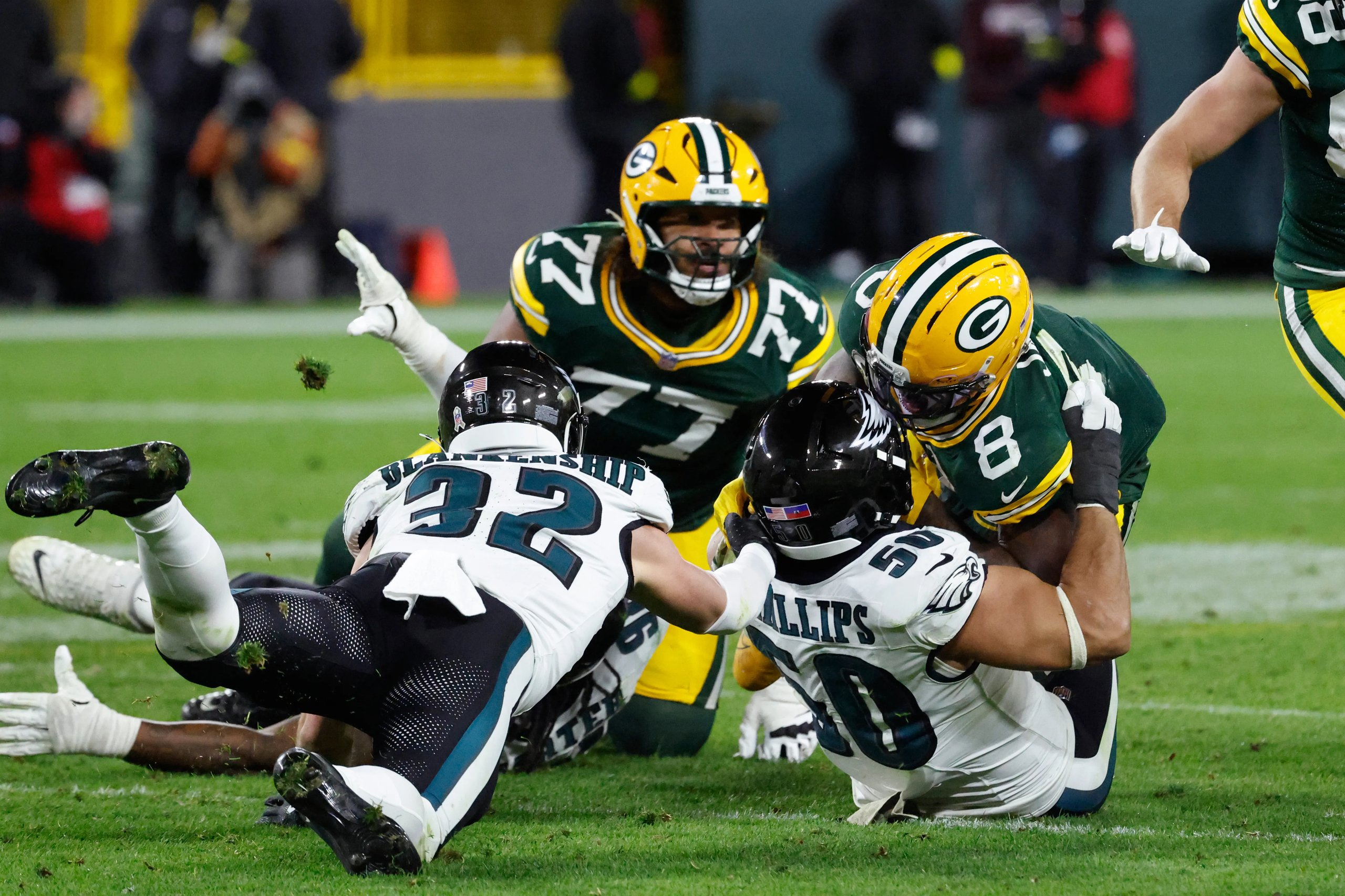 Philadelphia Eagles and Green Bay Packers players on the field at Lambeau Field during Monday Night Football 2025