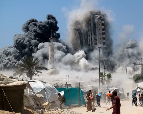 Aerial view of Gaza city with smoke and damaged buildings amid Israel-Palestine conflict, 2025