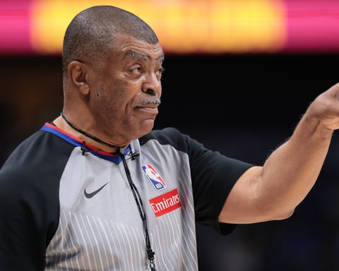 NBA referee using communication headset during 2025 season game