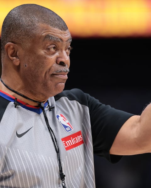 NBA referee using communication headset during 2025 season game