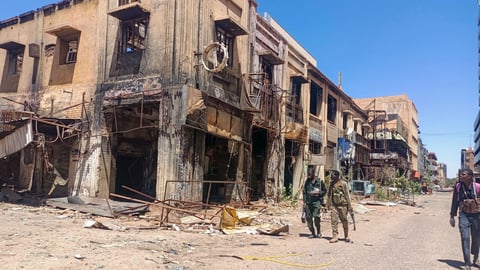 Armed Rapid Support Forces fighters patrolling streets of El-Fasher amid Sudan civil war 2025