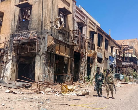 Armed Rapid Support Forces fighters patrolling streets of El-Fasher amid Sudan civil war 2025