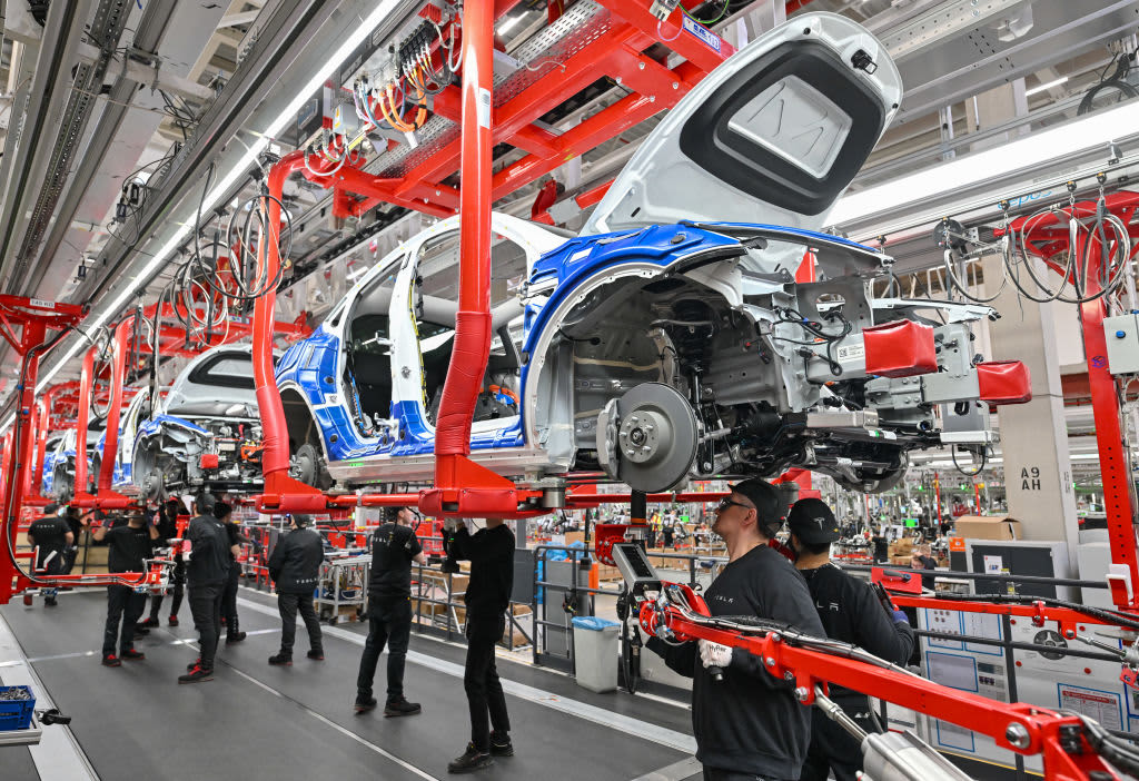 Tesla Electric Vehicle Factory Production Tesla factory assembly line producing electric vehicles