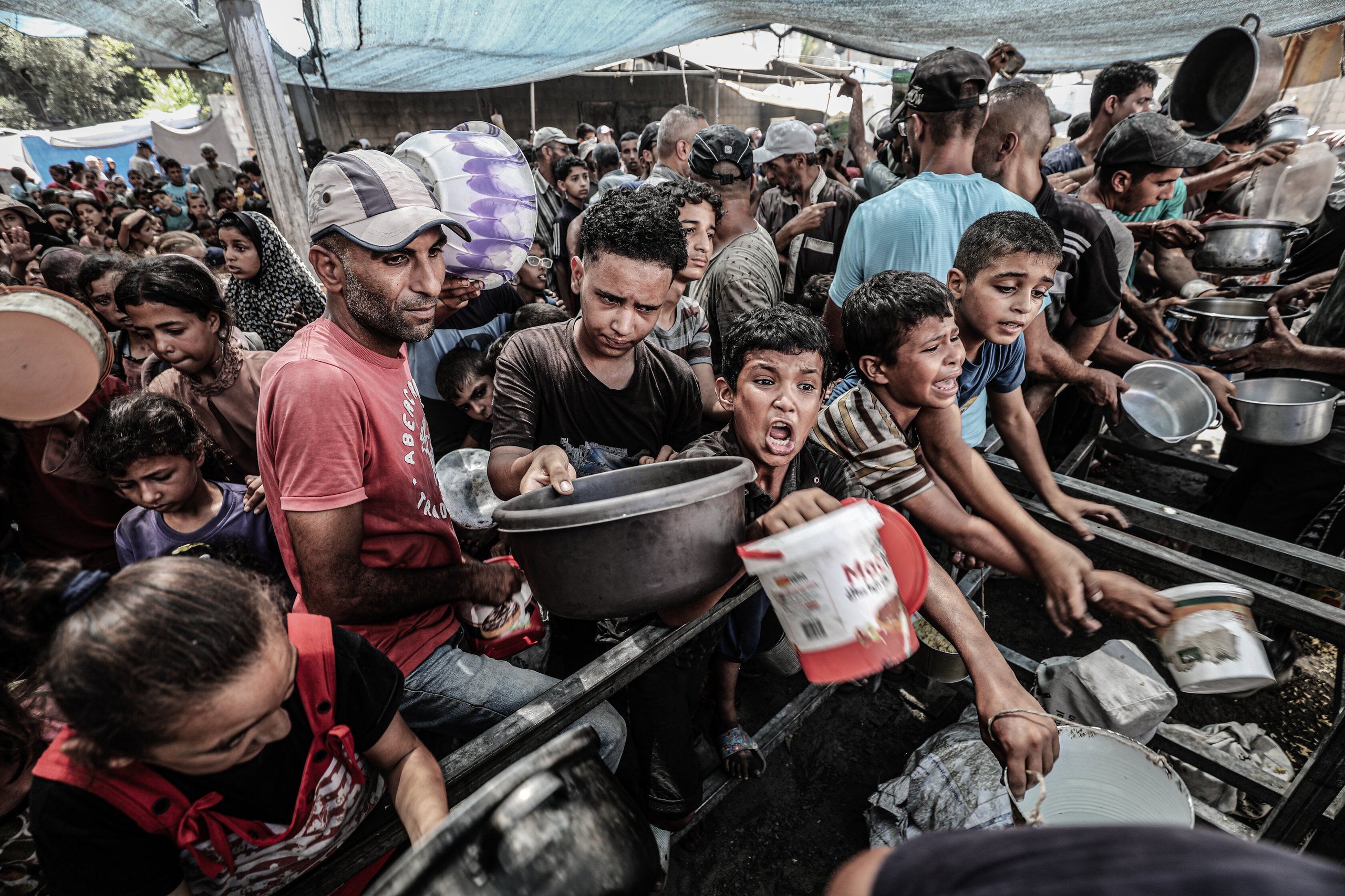 UNRWA workers distribute humanitarian aid to Gaza civilians