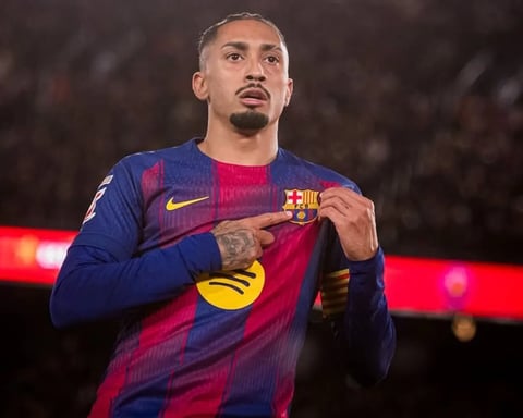 Barcelona forward Raphinha celebrates after scoring equalizer against Atletico Madrid at Camp Nou in La Liga December 2025