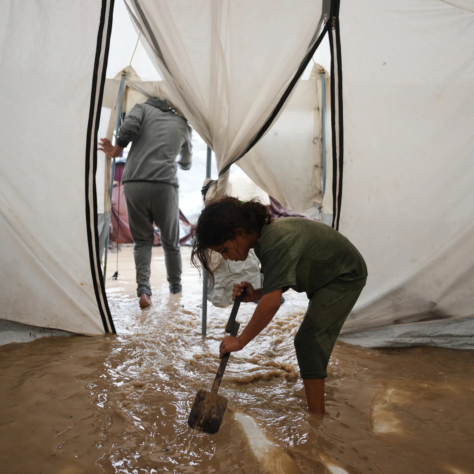 Gaza Families Face Deadly Winter Conditions Amid Aid Blockade Palestinian families struggle with flooded tents during winter storm as Israel blocks humanitarian aid