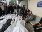 Palestinian mourners carry body of teenager killed by Israeli forces in West Bank raid December 2025