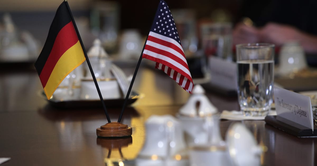 German and American flags representing diplomatic tensions over US visa bans on European activists