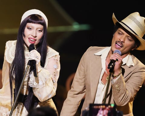 Lady Gaga and Bruno Mars performing hit "Die With A Smile" in 2025