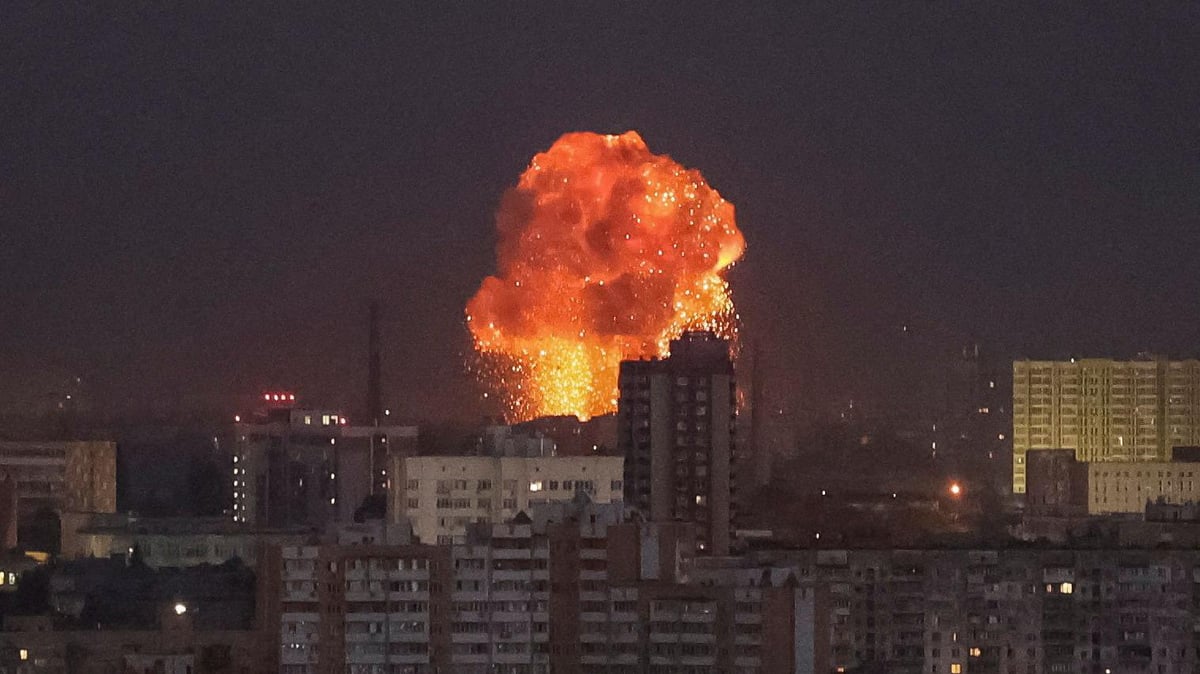 Missile strike aftermath in Kyiv with damaged buildings and smoke rising