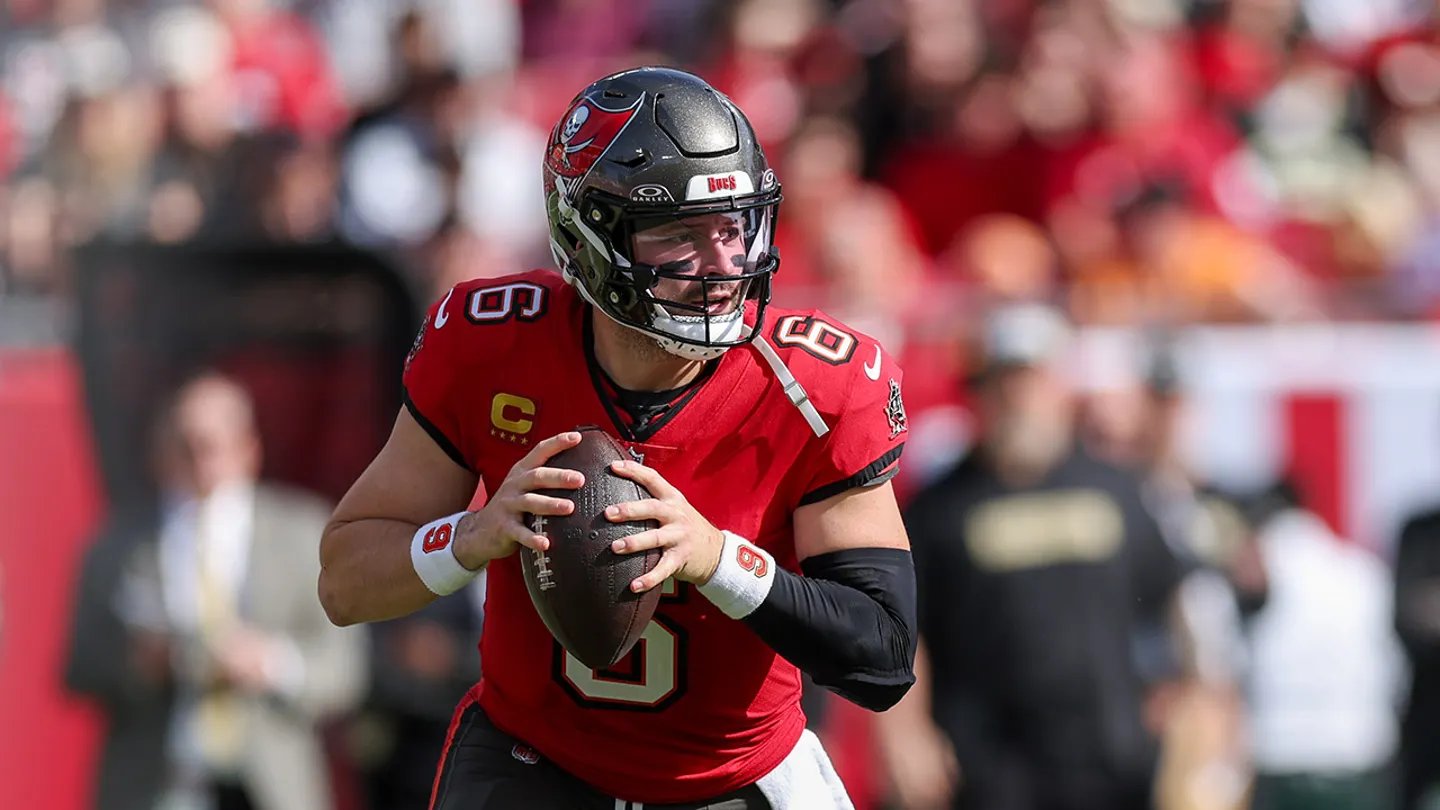 Baker Mayfield celebrates in rain after Buccaneers defeat Panthers 16-14 at Raymond James Stadium in NFC South playoff race