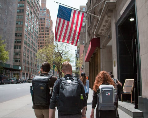 University students walk across campus as higher education in the US, UK, and Europe faces political pressure and funding uncertainty in 2026