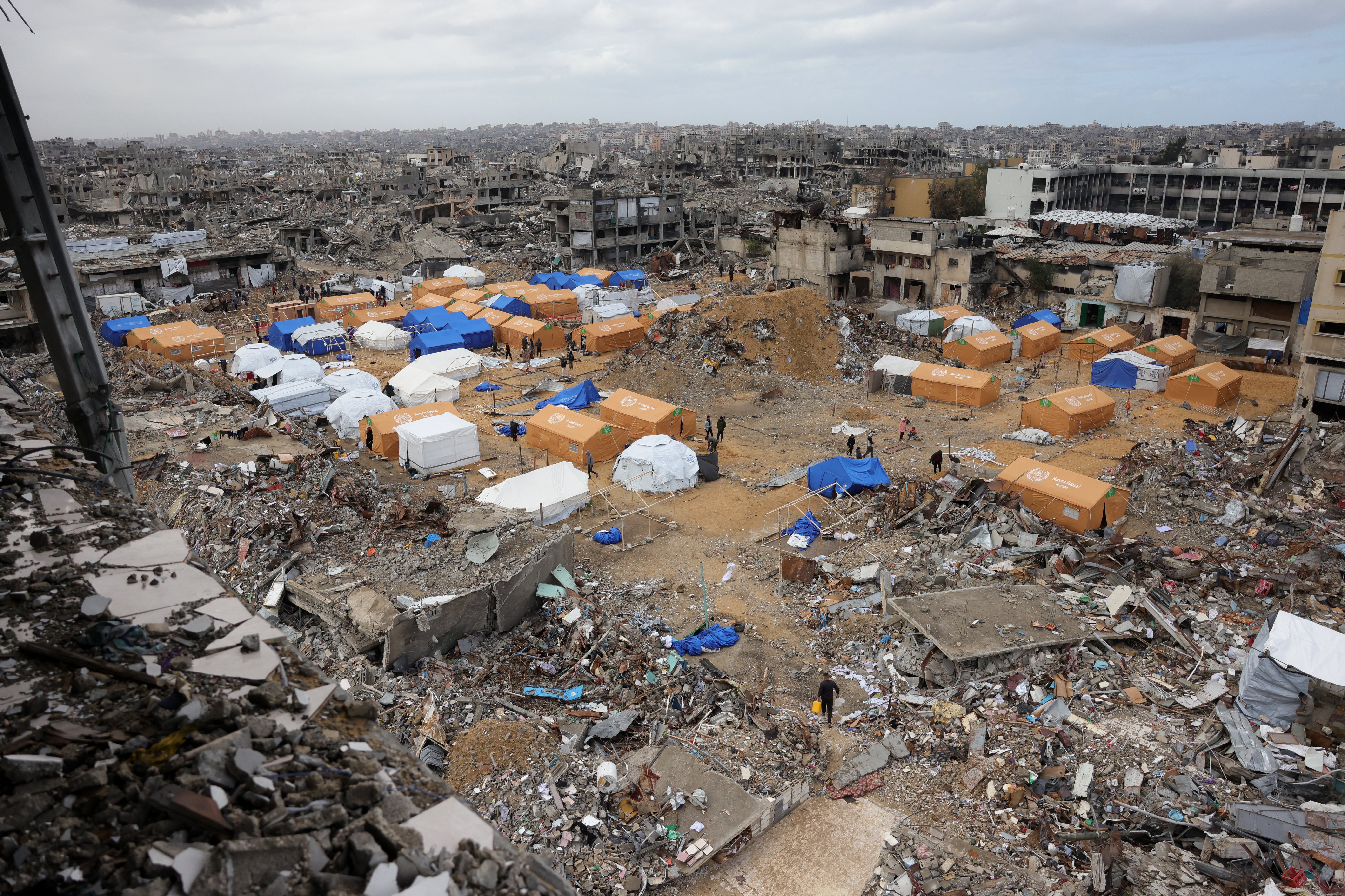 Large waste accumulation in Gaza City during wartime infrastructure collapse.