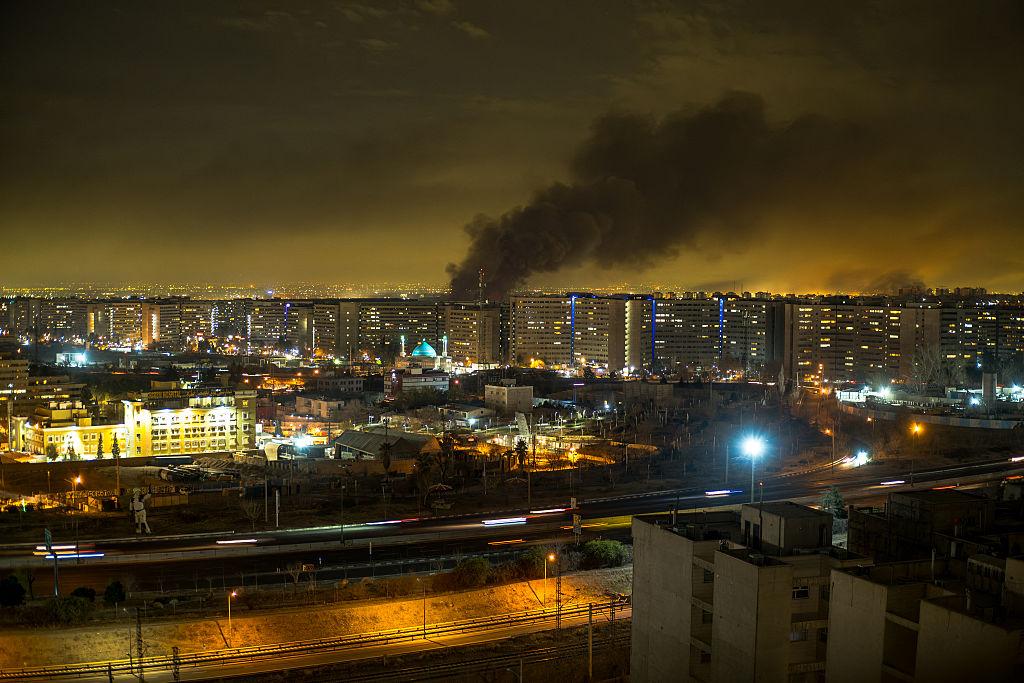 Tehran skyline lit by explosions after Israeli airstrikes hit oil and military targets in Iran