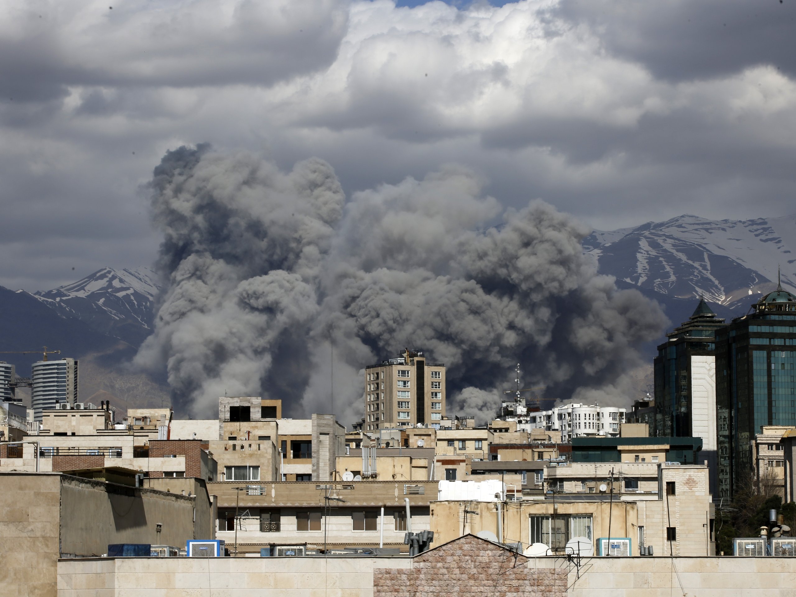 Israel attacks Iran as smoke rises over Tehran following US-Israeli airstrikes during the escalating Iran-Israel war