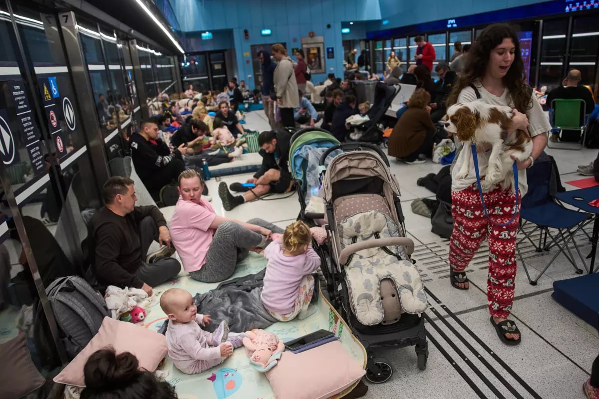 Civilians Take Shelter During Iranian Missile Barrage Israeli civilians rushing to shelters after Iranian missile alerts
