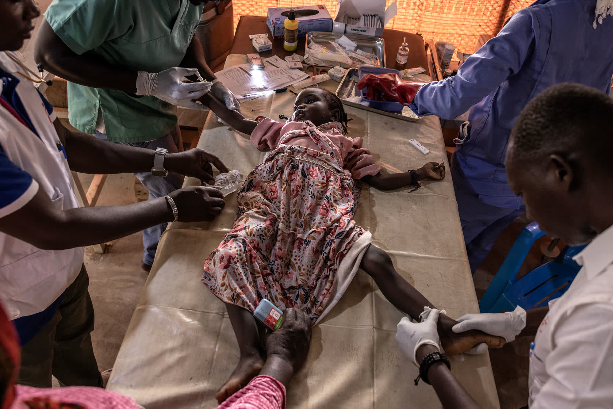 Injured civilians and doctors after Darfur hospital attack