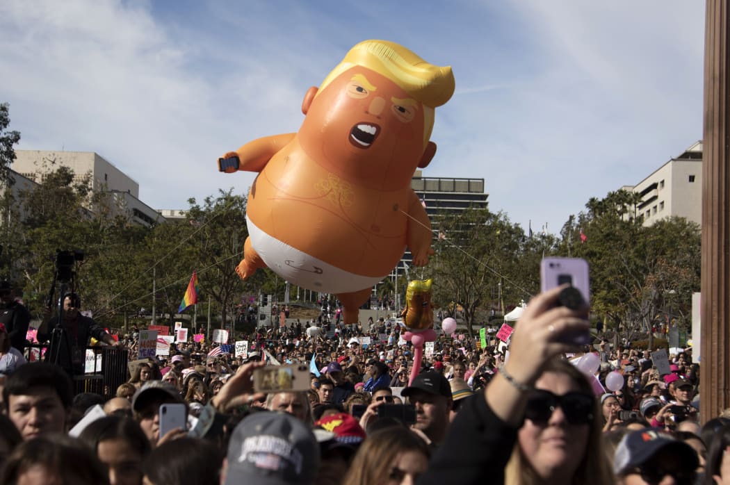 Giant inflatable Trump baby blimp floats above No Kings protesters at Los Angeles City Hall on March 28, 2026