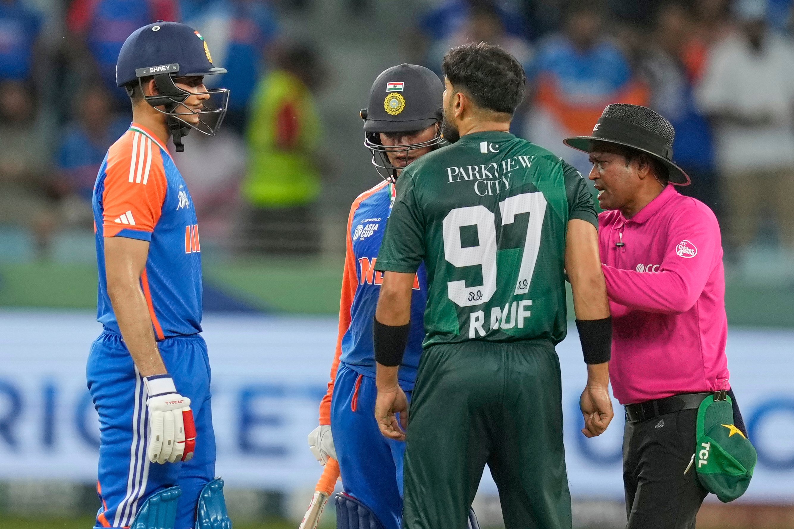 Players arguing during local cricket match in India