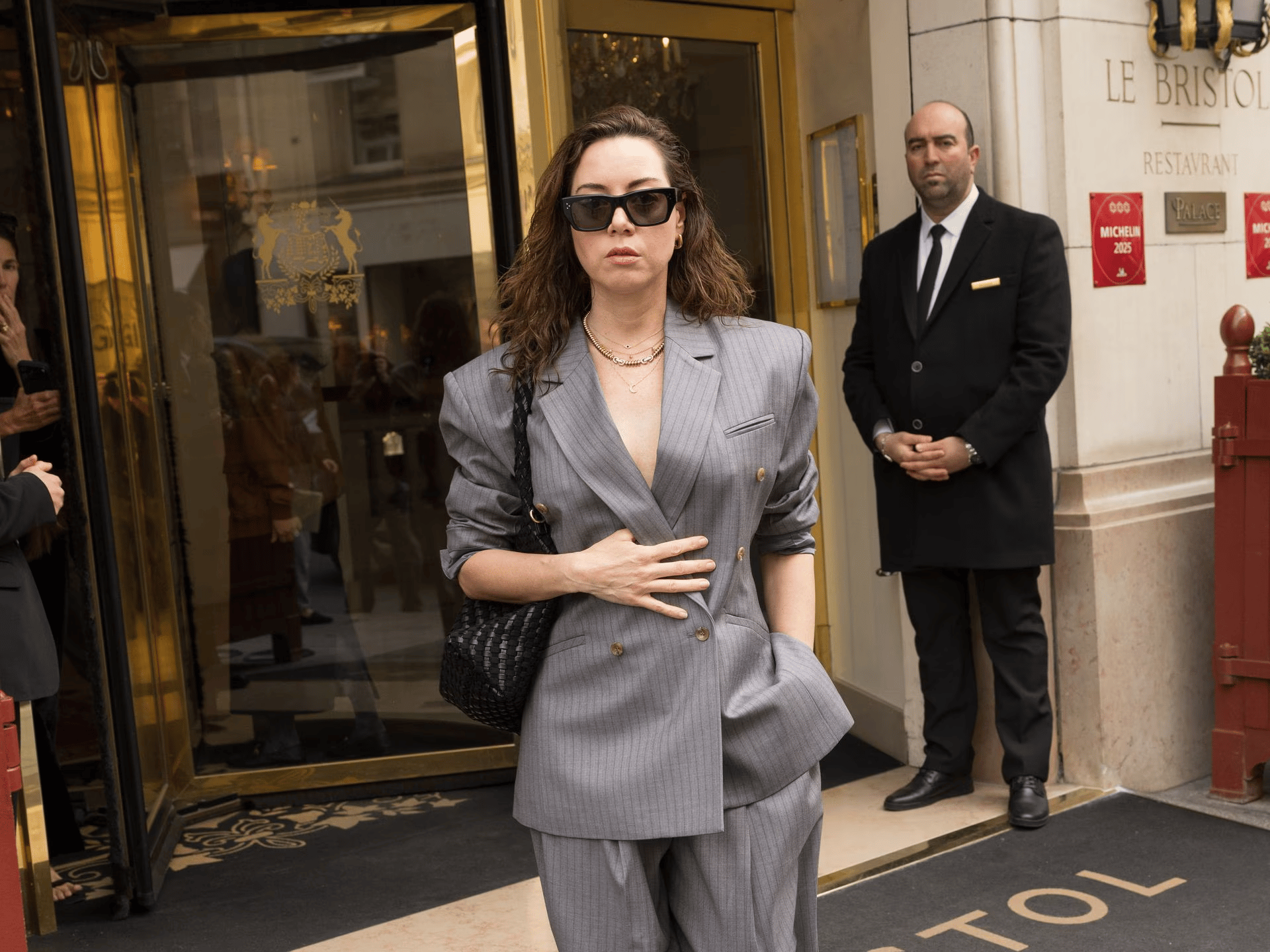 Aubrey Plaza wearing oversized outfit at Paris Fashion Week before pregnancy reveal