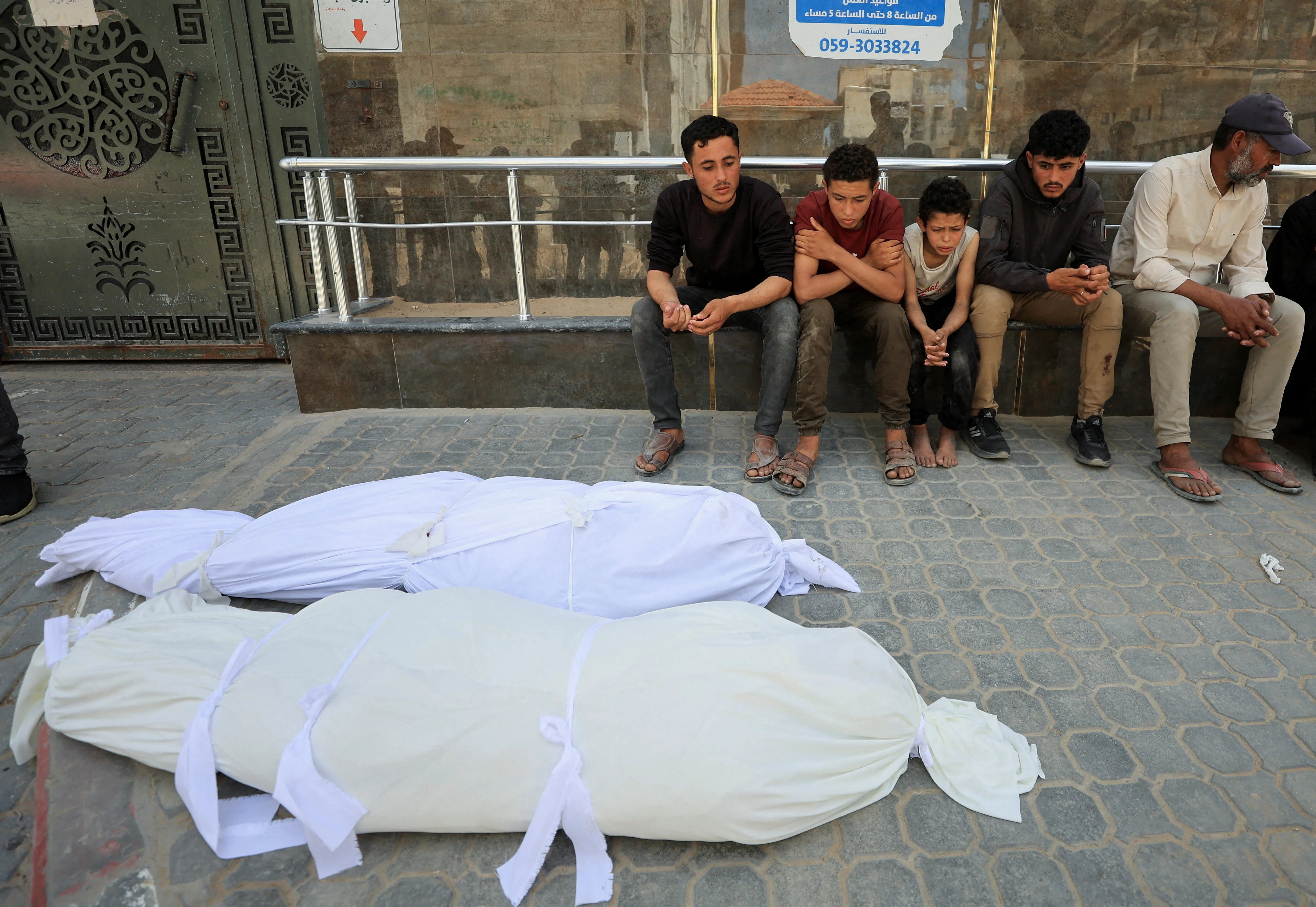 Civilians gather after Israeli airstrikes in Gaza amid ongoing violence