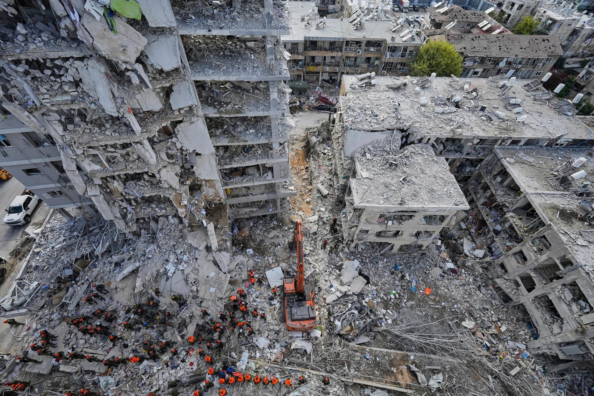 Aftermath of Israeli and US airstrikes in Iran showing destroyed buildings and rescue operations