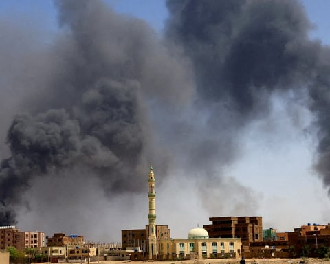 Thick black smoke billowing over residential buildings in El-Obeid, Sudan,