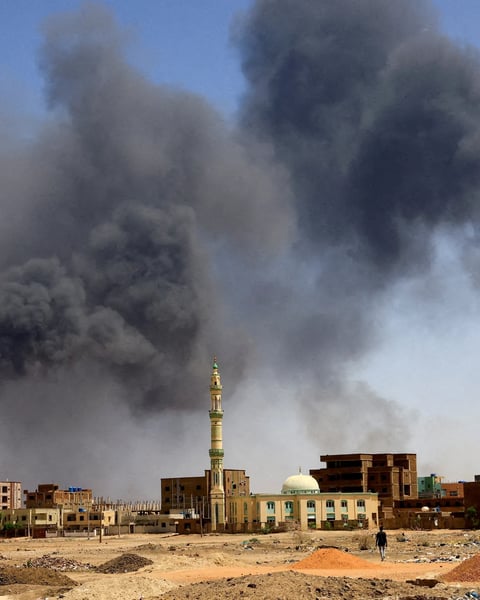 Thick black smoke billowing over residential buildings in El-Obeid, Sudan,