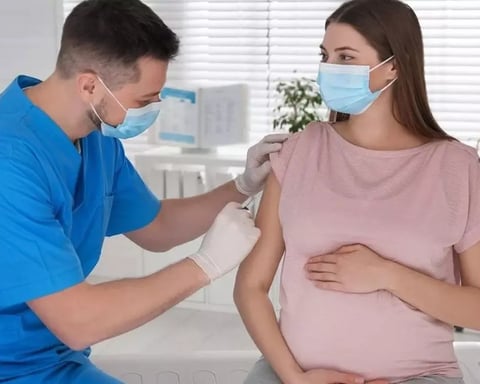 Pregnant woman receiving RSV vaccine consultation showing infant protection through maternal antibodies