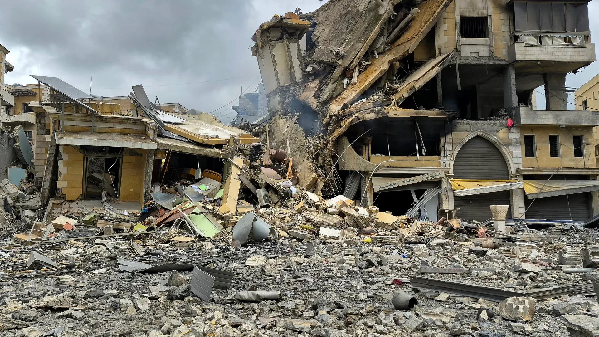 Sudan Civil War destruction in Khartoum with damaged buildings and civilians displaced