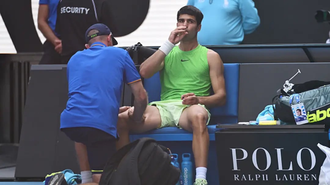 Carlos Alcaraz receives treatment on his wrist during a tournament