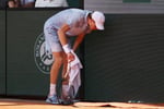 Jannik Sinner reacts during his shocking French Open 2026 defeat against Juan Manuel Cerúndolo in extreme Paris heat
