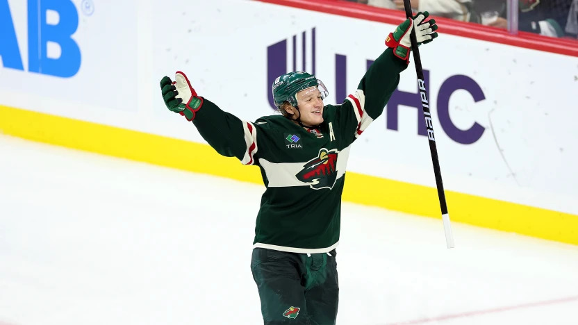 Kaprizov Offensive Dominance Game 3 Kirill Kaprizov handling puck in offensive zone during NHL playoff game vs Avalanche