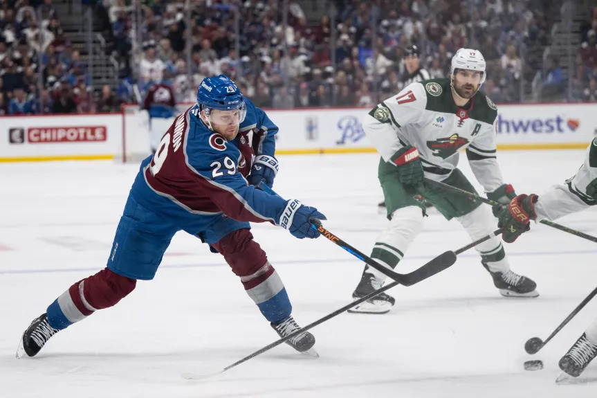 Nathan MacKinnon skating with the puck during the NHL playoffs