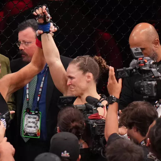 Ronda Rousey locking armbar submission on Gina Carano during rapid MMA fight finish