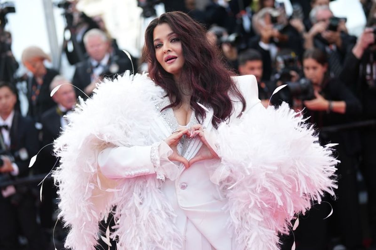 Aishwarya Rai Bachchan in a white structured suit at the closing ceremony of the 79th Cannes Film Festival