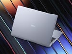 Alienware Aurora 16X gaming laptop with RTX 50-series GPU and OLED display in RGB setup